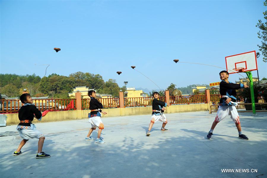 The White Pants Yao, or Baiku Yao in Chinese, is a branch of the Yao ethnic group in southwest China. Playing the whipping top is a popular game for them during festival times.