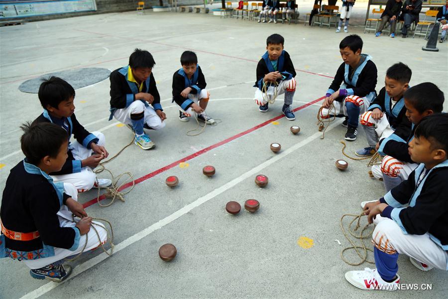 The White Pants Yao, or Baiku Yao in Chinese, is a branch of the Yao ethnic group in southwest China. Playing the whipping top is a popular game for them during festival times.