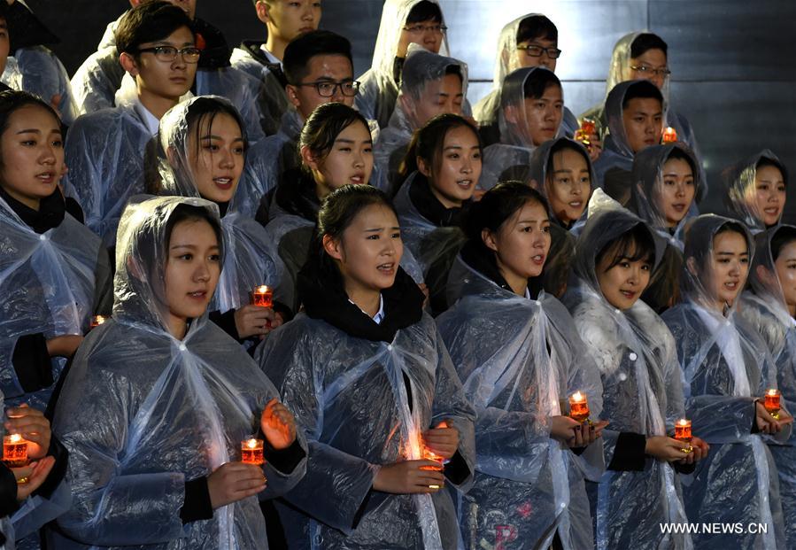 Photo taken on Dec. 13, 2016 shows the scene of a candlelight vigil for China's National Memorial Day for Nanjing Massacre Victims at the memorial hall for the massacre victims in Nanjing, east China's Jiangsu Province. (Xinhua/Sun Can)