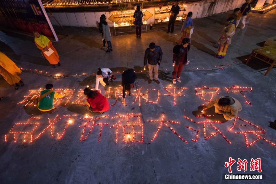 Buddhists light candles, pray for peace on border between China and Myanmar