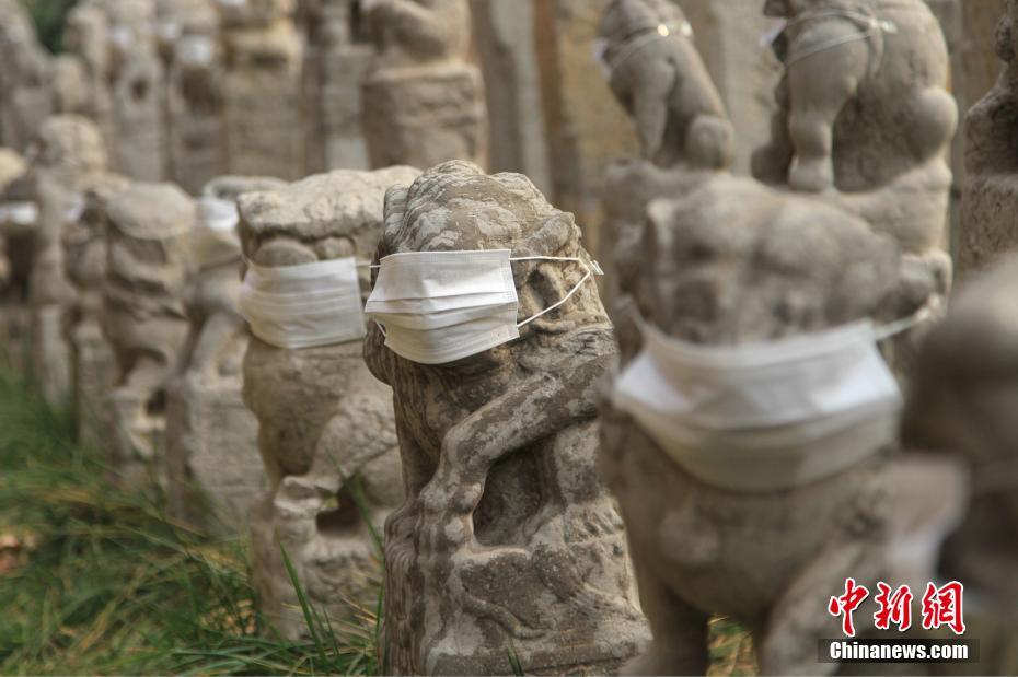 Mask-clad lion statues in Xi'an