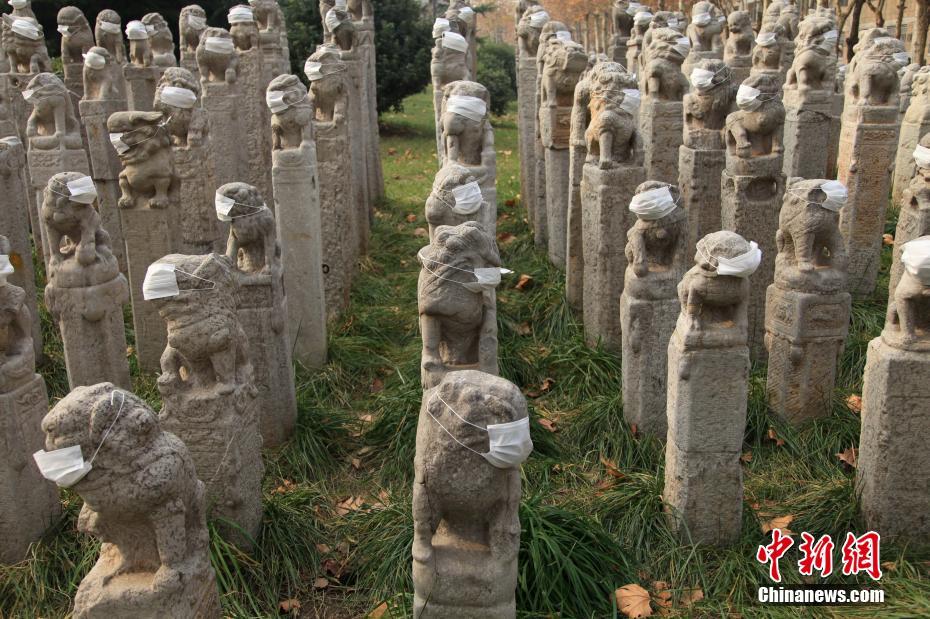 Mask-clad lion statues in Xi'an