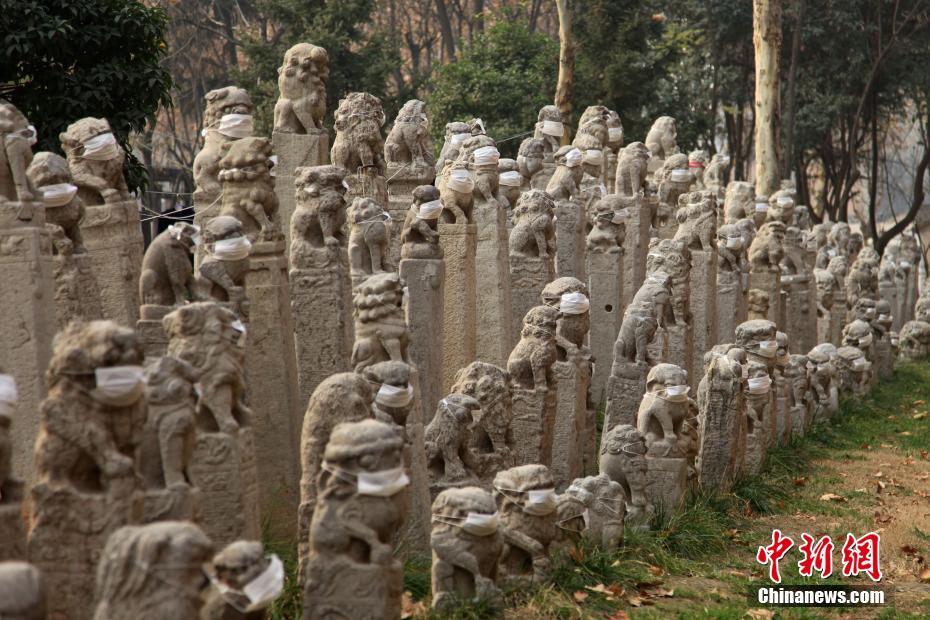 Mask-clad lion statues in Xi'an