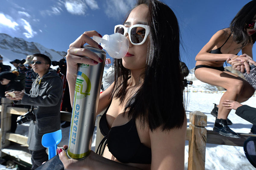Bikini-clad live-streaming hosts broadcast snowman-building on 5,000-meter-high mountain