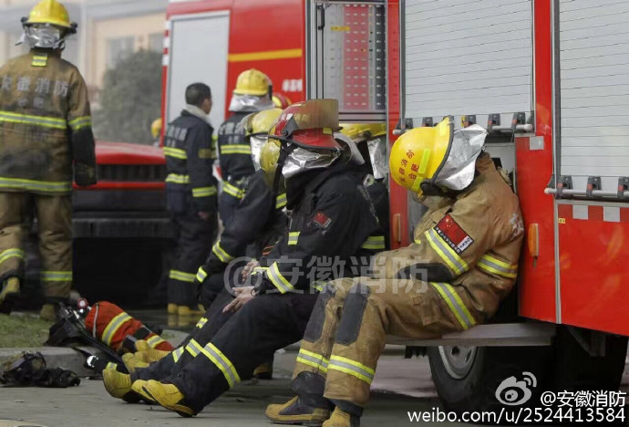 Exhausted firefighters spotted sleeping in street