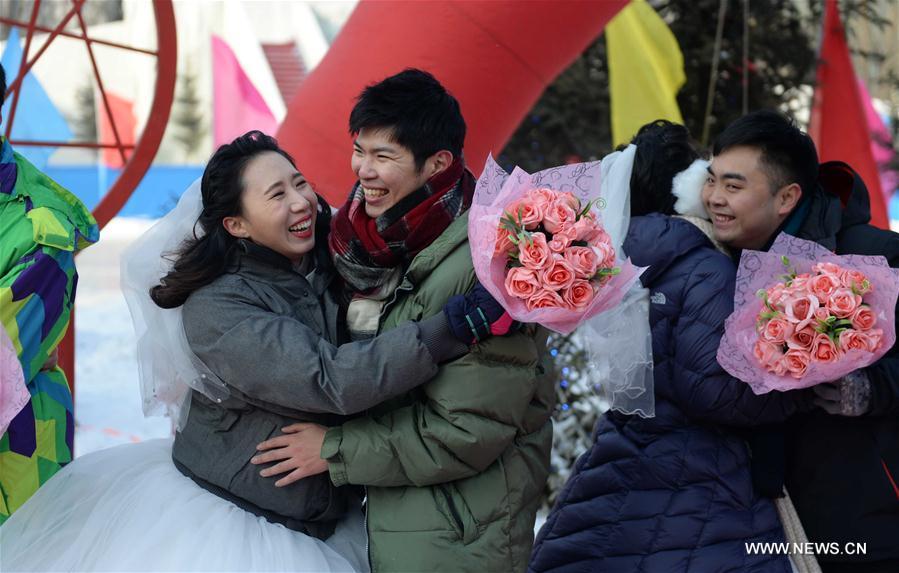 Group wedding ceremony held during Harbin Ice and Snow Festival