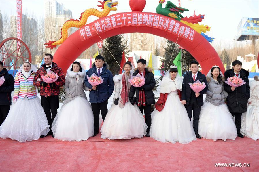 Group wedding ceremony held during Harbin Ice and Snow Festival