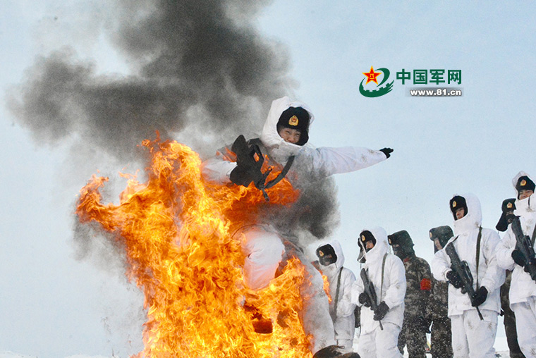 Armed police train amid flames, snow in Xinjiang