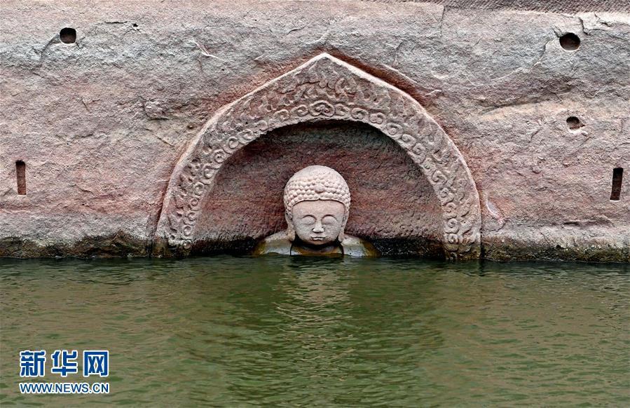 Buddha figure emerges as Jiangxi reservoir level drops