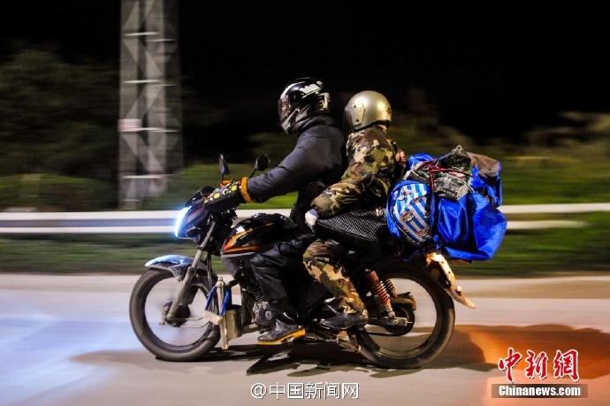 Migrant workers ride home on motorcycles to save money