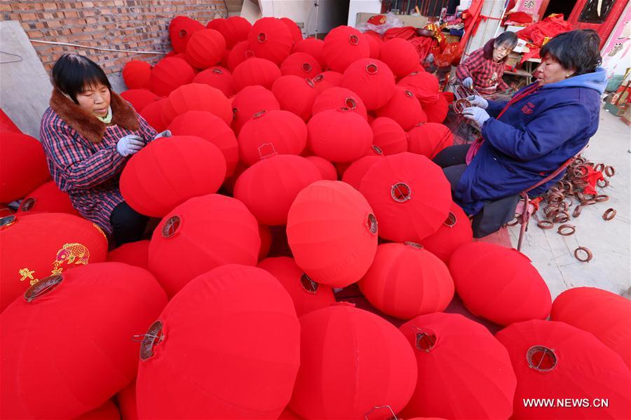Villagers make red lanterns in Beileng Township of Wenxian County, central China's Henan Province, Jan. 12, 2017. Villagers need to keep up with the lantern orders to meet the Spring Festival market demand. The Spring Festival falls on Jan. 28 this year. (Xinhua/Xu Hongxing) 