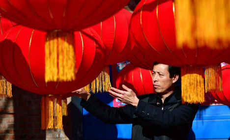 Red lanterns made for Spring Festival decorations in N China's village