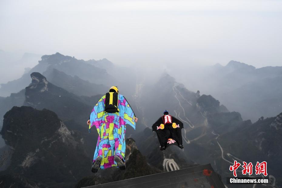 Chinese wingsuit pilot trains on freezing Tianmenshan Mountain