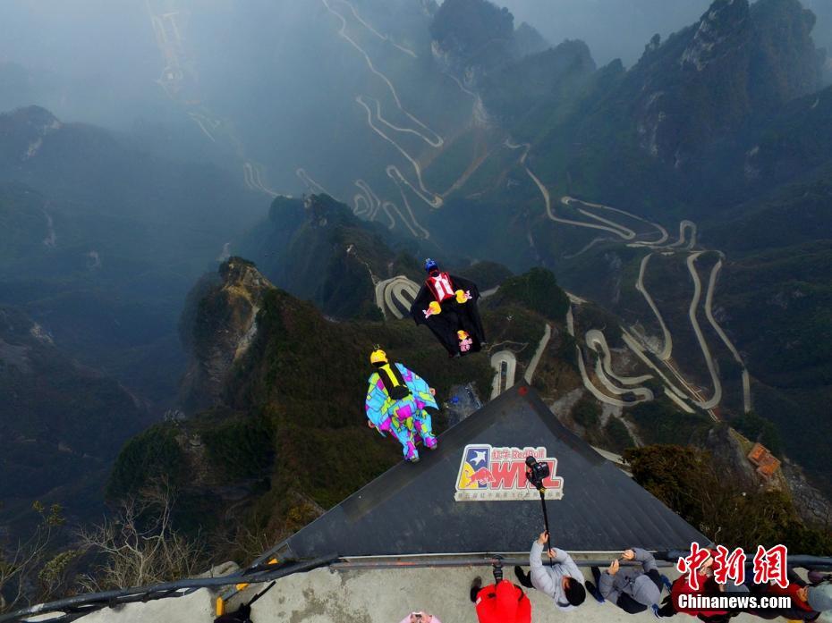 Chinese wingsuit pilot trains on freezing Tianmenshan Mountain