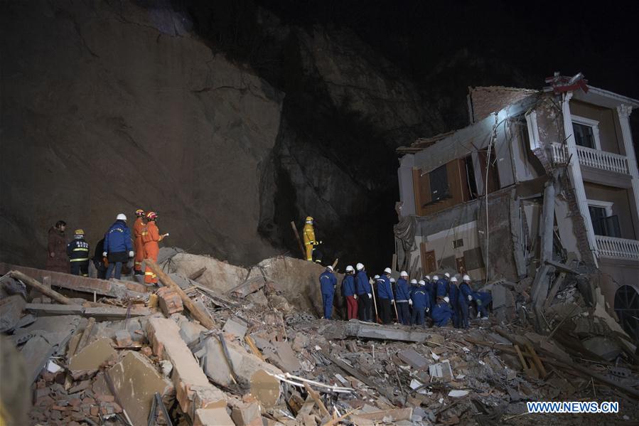 14 buried in central China landslide