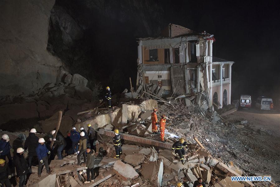 14 buried in central China landslide