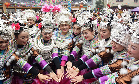 Miao ethnic people dance to celebrate Spring Festival
