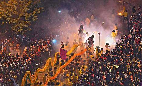 Dragon dance performed with firecrackers 