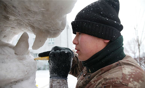 Soldiers and officers make snow sculptures