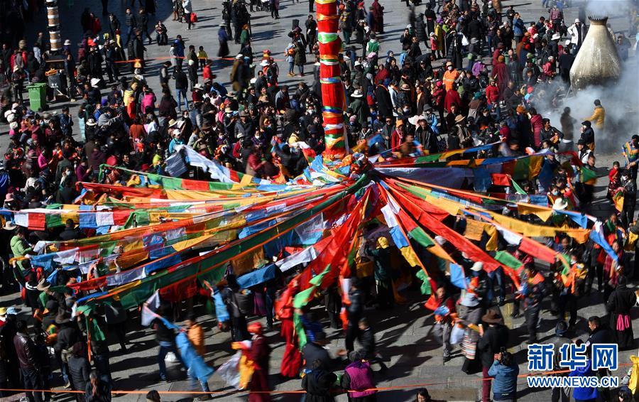 Jokhang Temple changes prayer flags to celebrate Tibetan New Year