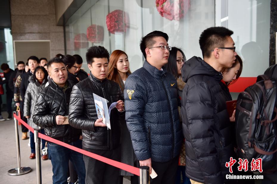 Love birds register for marriage in traditional Chinese wedding apparel