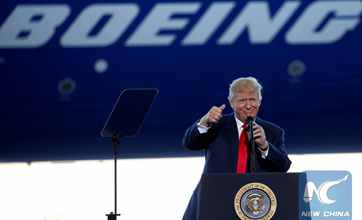 Trump touts "America first" agenda in visit to Boeing factory