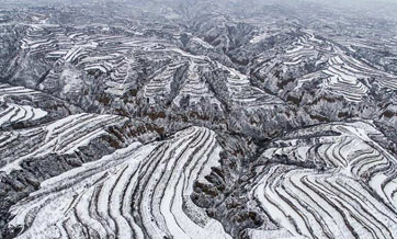Snow-capped Loess Plateau resembles black-and-white photo