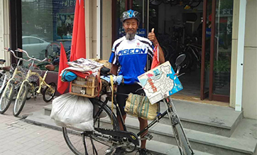 Octogenarian poised to complete bike tour around China