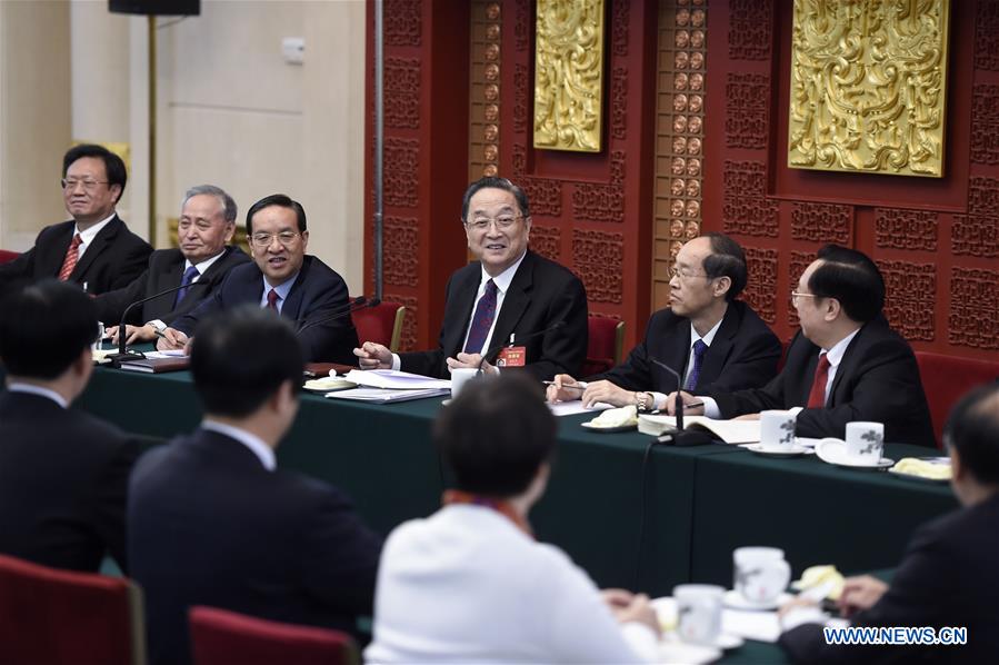 Chinese leaders review gov't work report with lawmakers