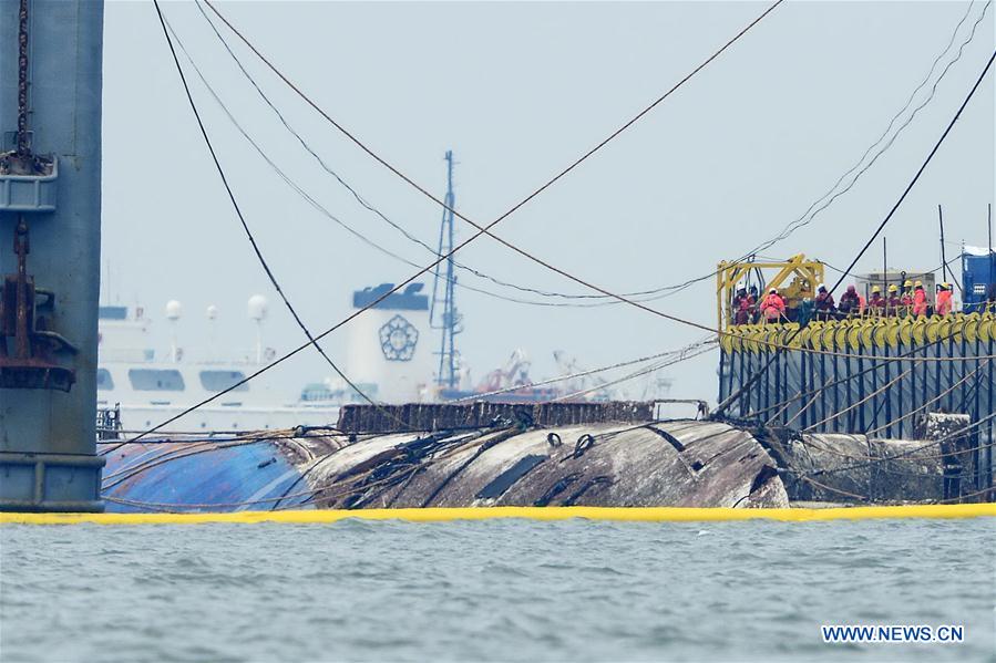 Sunken S. Korean ferry Sewol lifted from sea 3 years after shipwreck