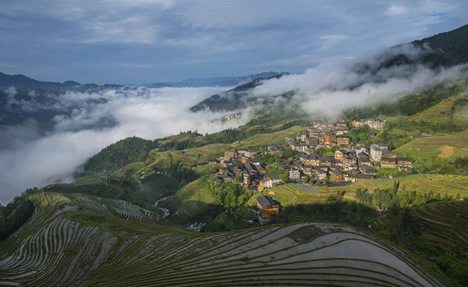 Terraces shrouded by clouds in Guangxi