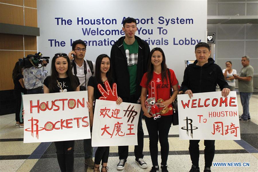 China's basketball player Zhou Qi arrives in Houston