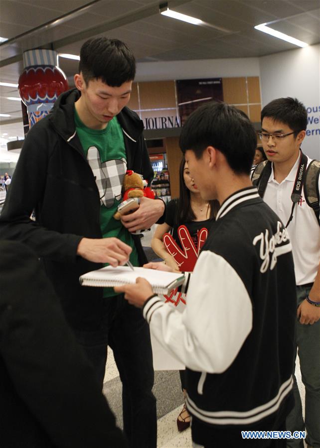 China's basketball player Zhou Qi arrives in Houston