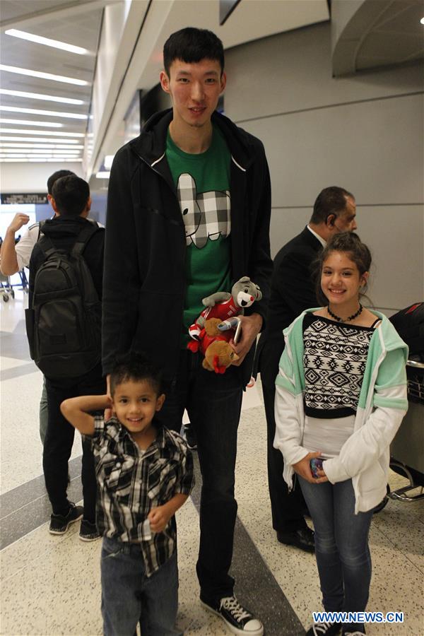 China's basketball player Zhou Qi arrives in Houston