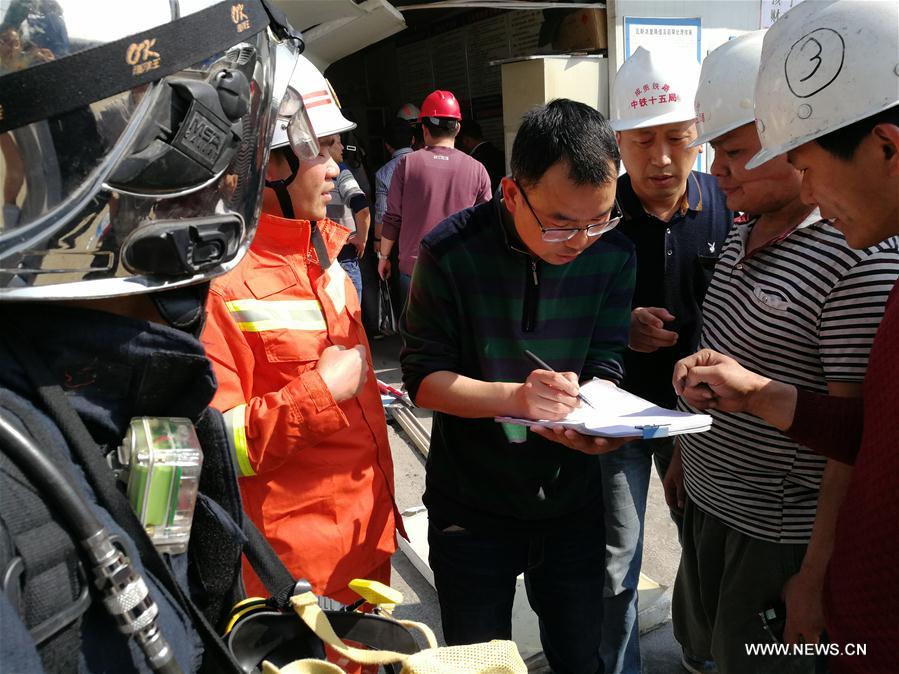 China tunnel blast injures 12, traps 12