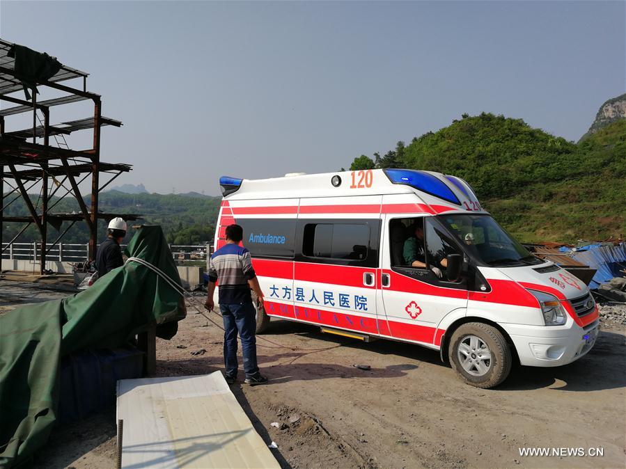 China tunnel blast injures 12, traps 12