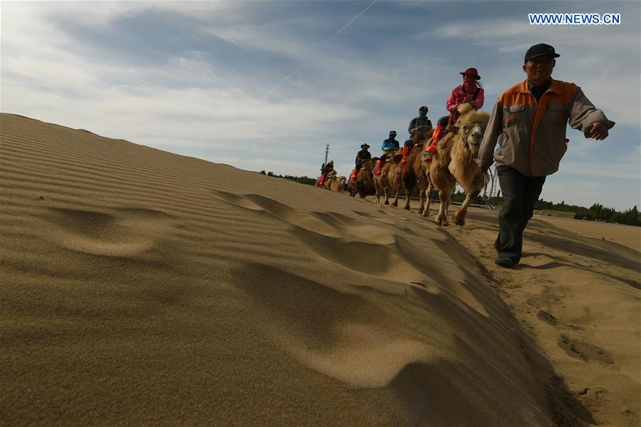 Mingsha Sand Mountain scenery zone in Dunhuang attracts tourists