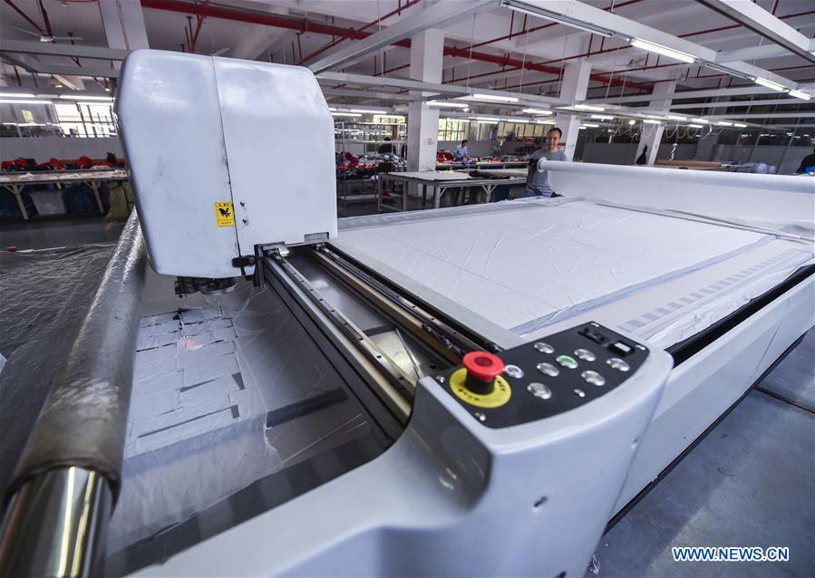 Automated garment manufacturing equipment introduced in Zhejiang, China