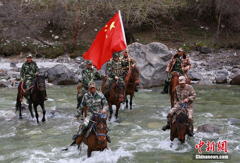 Xinjiang armed police patrol border on horseback