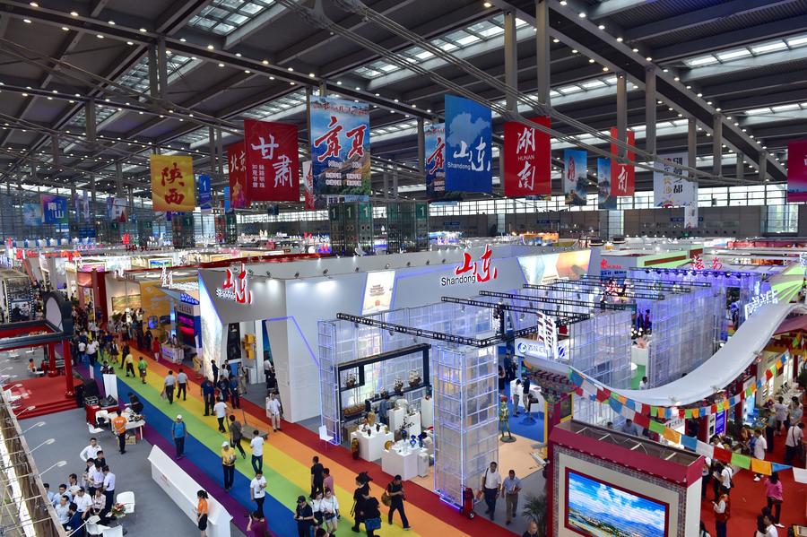 People attend the 13th China (Shenzhen) International Cultural Industries Fair in Shenzhen, South China's Guangdong province, May 11, 2017. The 5-day fair started on May 11, attracting 2,302 exhibitors. (Photo/Xinhua)