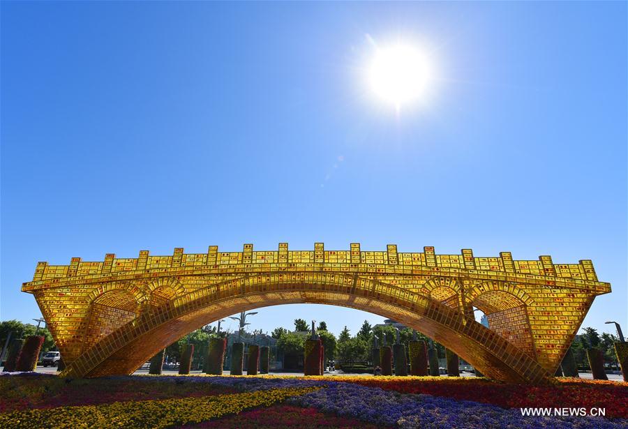 Photo taken on May 13, 2017 shows the "Golden Bridge on Silk Road" structure outside the National Convention Center in Beijing, capital of China. The Belt and Road Forum for International Cooperation will be held here from May 14 to 15. (Xinhua/Li He)
