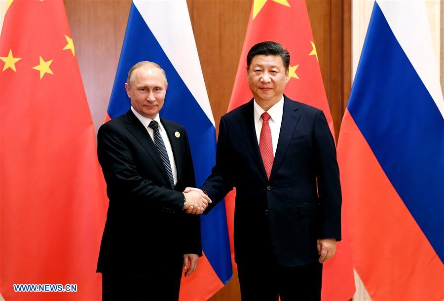 Xi says China, Russia play role of 