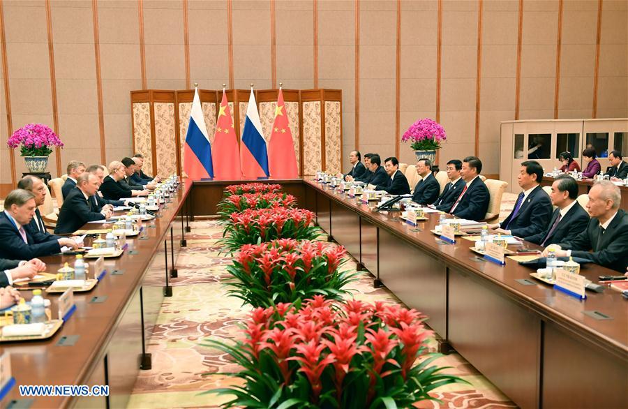 Xi says China, Russia play role of 