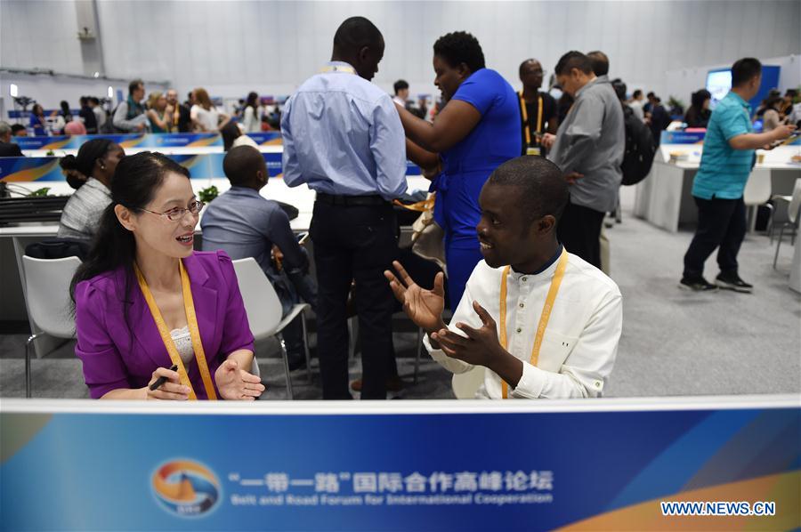 A foreign journalist (R front) receives an interview at the China National Convention Center in Beijing, capital of China, May 14, 2017. Media gathered here to report the Belt and Road Forum (BRF) for International Cooperation, which opened in Beijing on Sunday. (Xinhua/Ju Huanzong)