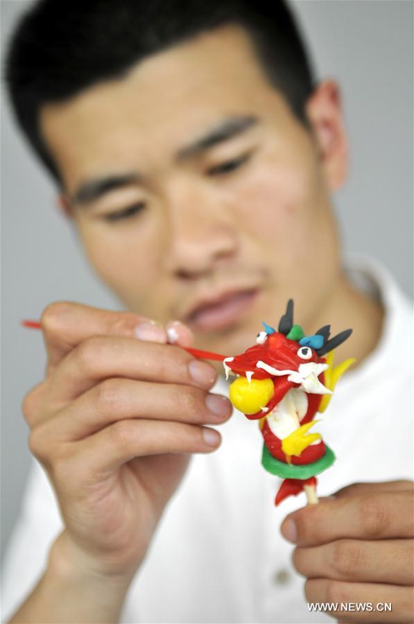 Dough figurines made by folk artist in E China