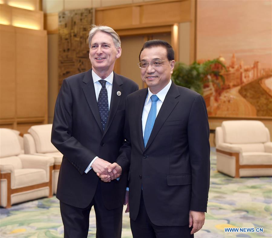 Chinese Premier Li Keqiang (R) meets with British Chancellor of the Exchequer Philip Hammond, who is special envoy of British Prime Minister Theresa May and is here for the Belt and Road Forum (BRF) for International Cooperation, in Beijing, capital of China, May 15, 2017. (Xinhua/Zhang Duo)