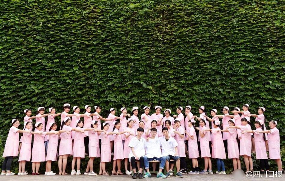 Male nursing school students hold signs to highlight gender in graduation photos 