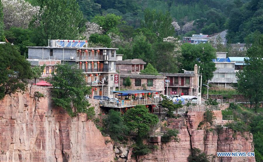 Villagers in China's Henan cast off poverty thanks to Guoliang cliff corridor