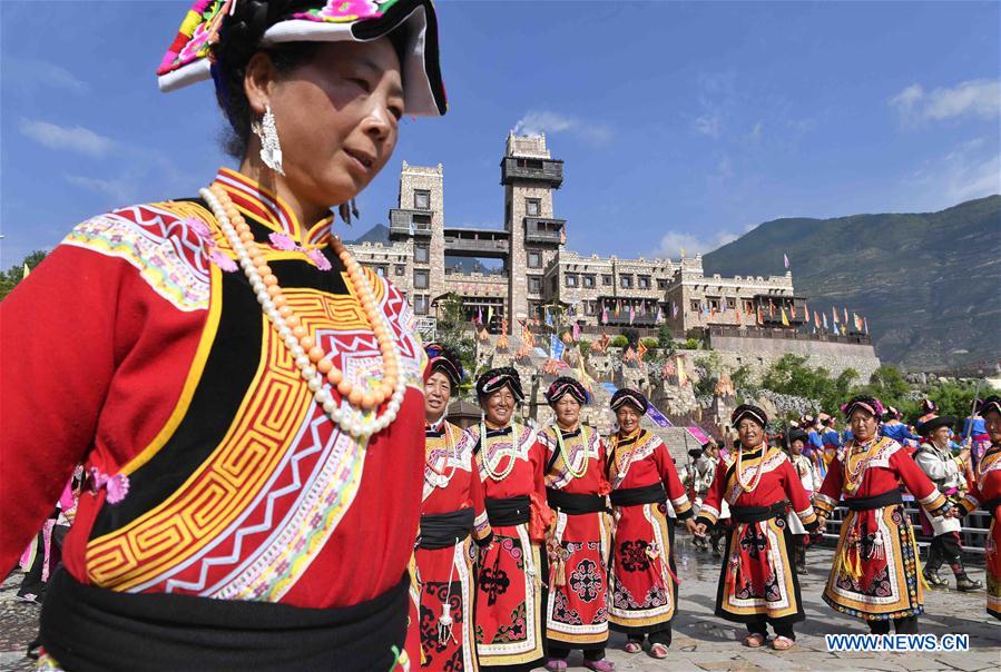 Women of Qiang ethnic group dance at folk Waerezu Festival
