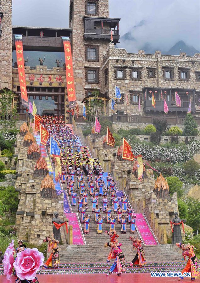 Women of Qiang ethnic group dance at folk Waerezu Festival
